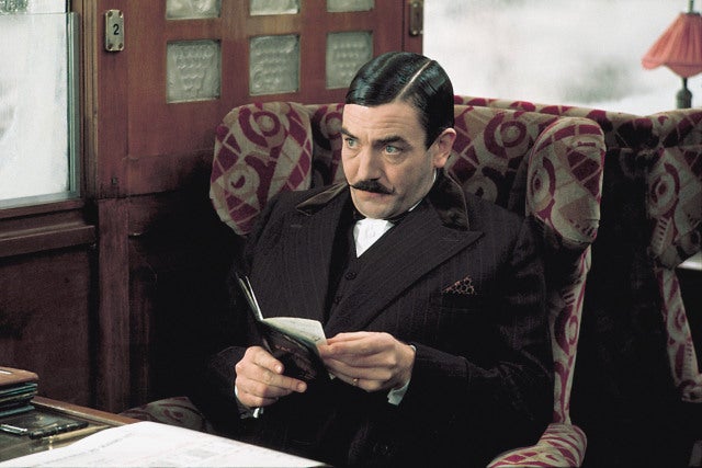 Albert Finney with a large moustache.